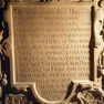 Roll- und Beschlagwerktafel mit 16zeiliger Grabinschrift auf der Grabplatte der Gräfin Dorothea von Erbach.