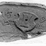 Jahreszahl und Namensinschrift auf einem Wappenstein in der Hauswand des ehemaligen Mühlengebäudes.