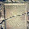Bild zur Katalognummer: Rollwerktafel mit Inschrift auf der Grabplatte des landgräflich-hessischen Beamten Ludwig Zöllner von Speckswinkel