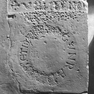 Bruchstück der Grabplatte eines Abtes Conrad