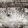 Namensinschrift am romanischen Eingangsportal der ehemaligen Scheune