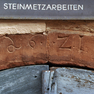 Jahreszahl am im Sturzbogen des Kellereingangs auf der Südseite des nördlichen Baus.